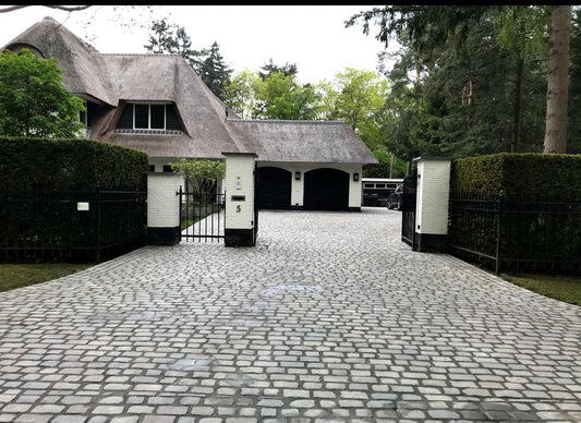 Wat kost een oprit van kasseien?